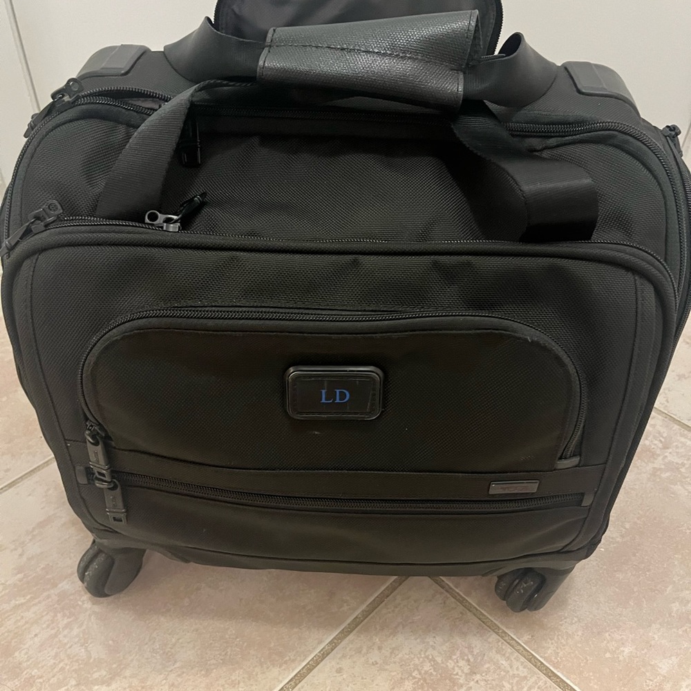 Tumi small 4 wheel suitcase
